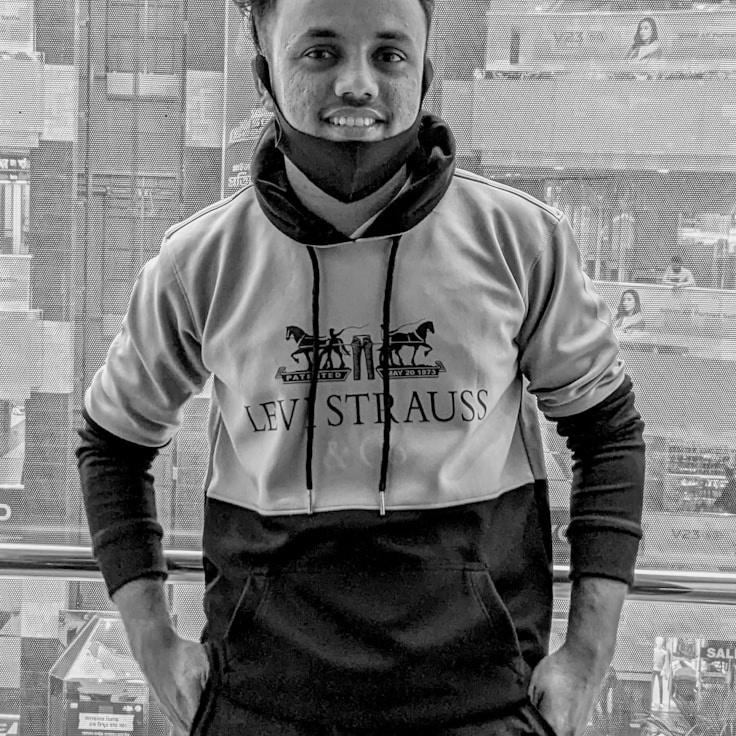 New name, Lead Design Curator at FreshShoresSpace, reviewing corporate floral arrangements